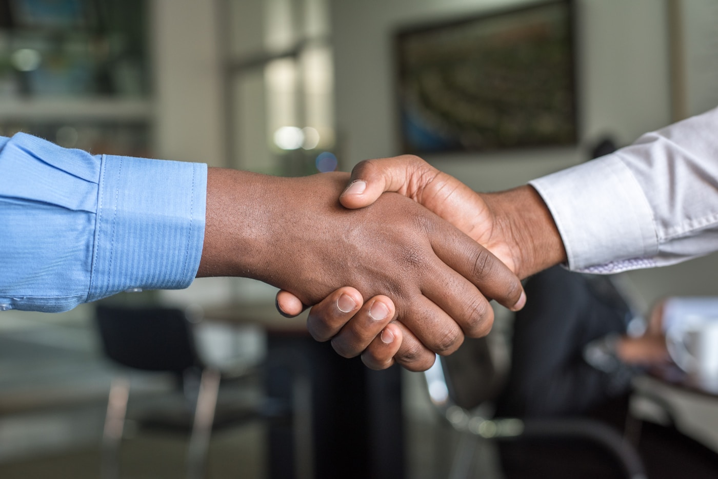 Business partners shaking hands after a discussion